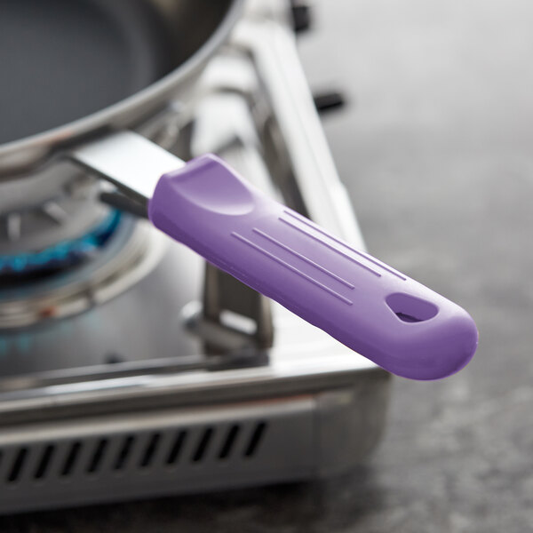 A close-up of a Choice purple silicone handle on a pan.