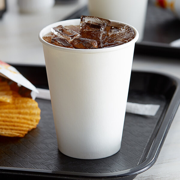 A tray with a Choice white poly paper cold cup filled with ice.