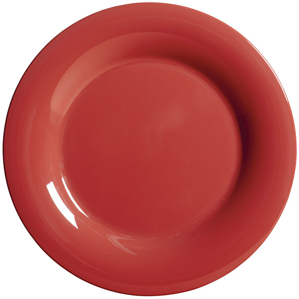 A close-up of a cranberry red GET Diamond Harvest wide rim plate.