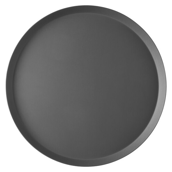 A close-up of a round black Vollrath pizza cutter plate.