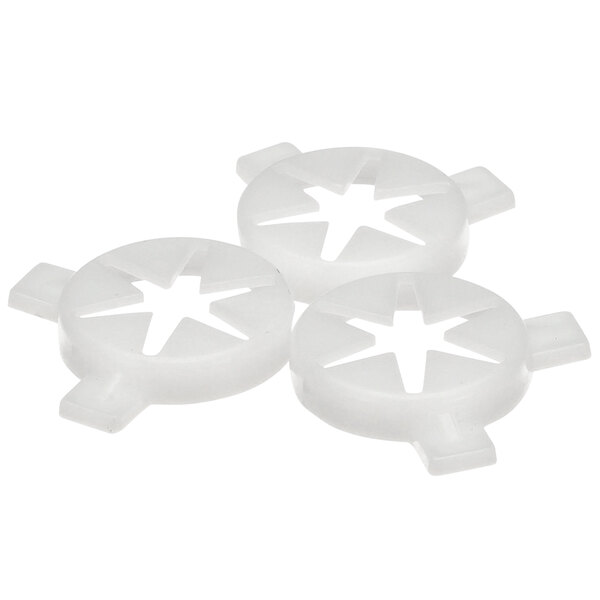 Three white plastic Spaceman 6-pointed star caps.