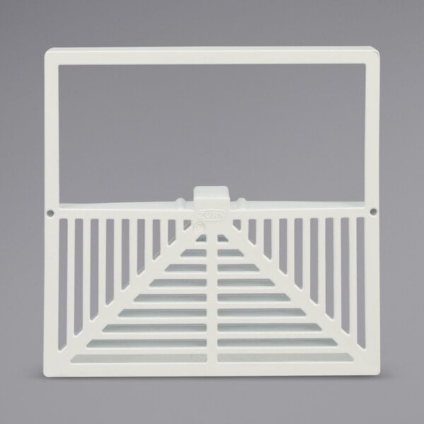 A white plastic square grate with a handle for a Zurn floor sink.