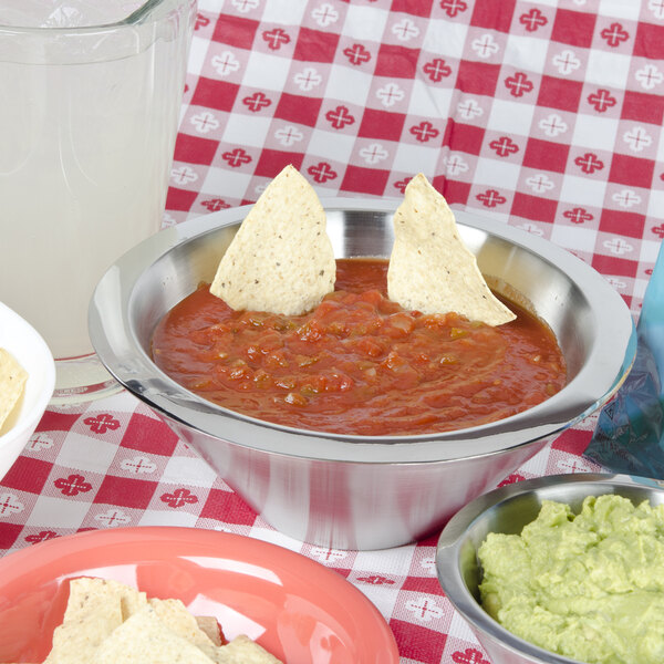 An American Metalcraft stainless steel double wall conical bowl filled with chips and a bowl of salsa.