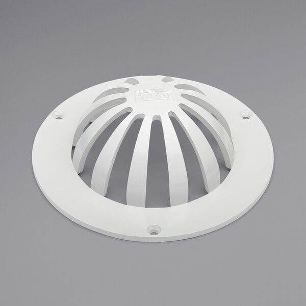 A white plastic dome bottom strainer with holes.