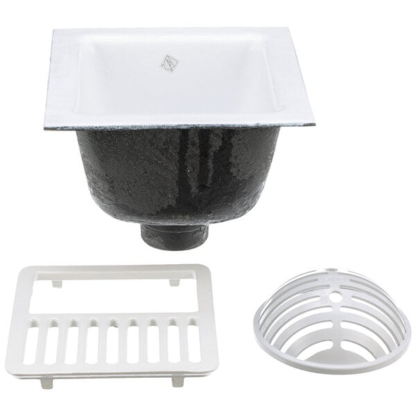 A black Zurn cast iron floor sink with a white square drain cover.