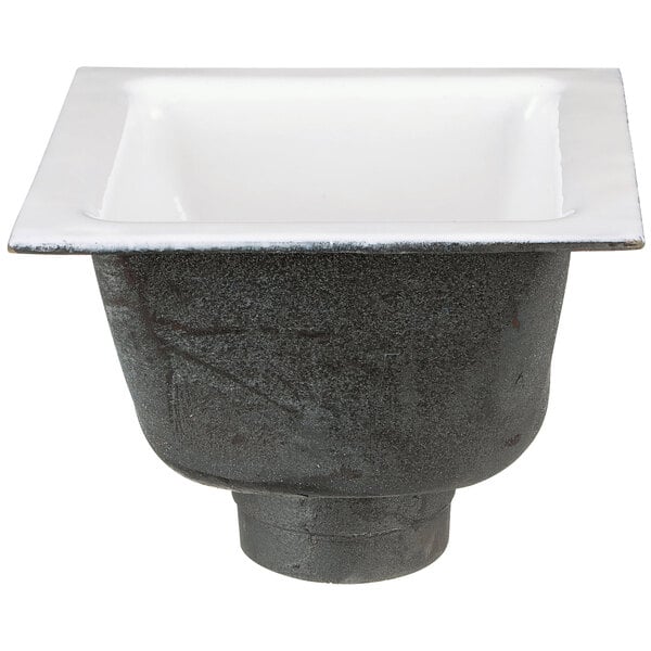 A black Zurn cast iron floor sink with a white bowl inside.