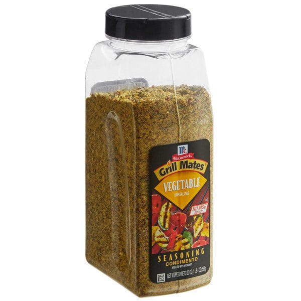 A container of McCormick Grill Mates Vegetable Seasoning with a lid on it.
