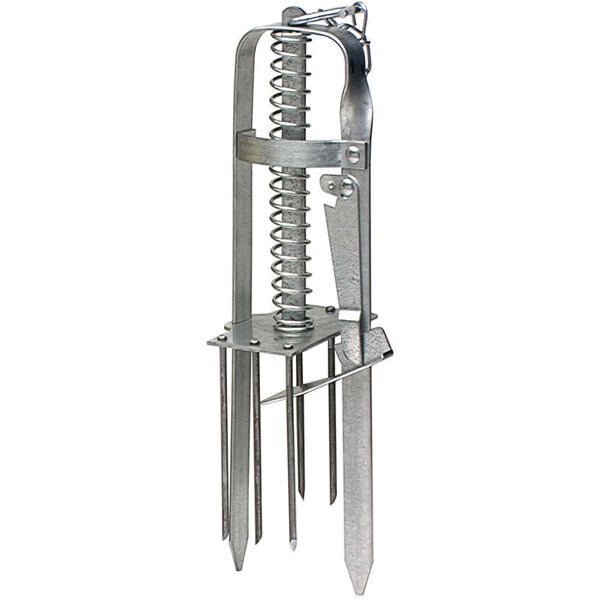 A Victor Pest mole trap, a metal device with a spring and a screw on top.