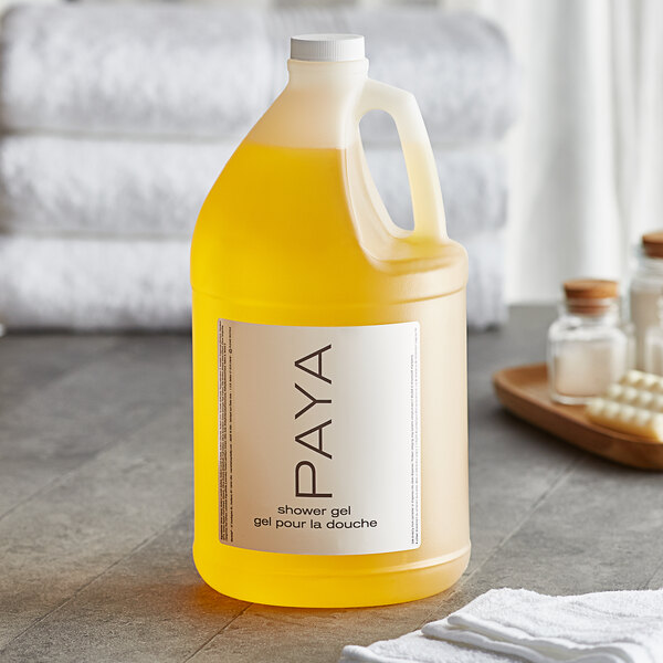 A white jug of PAYA yellow liquid soap with a white cap.