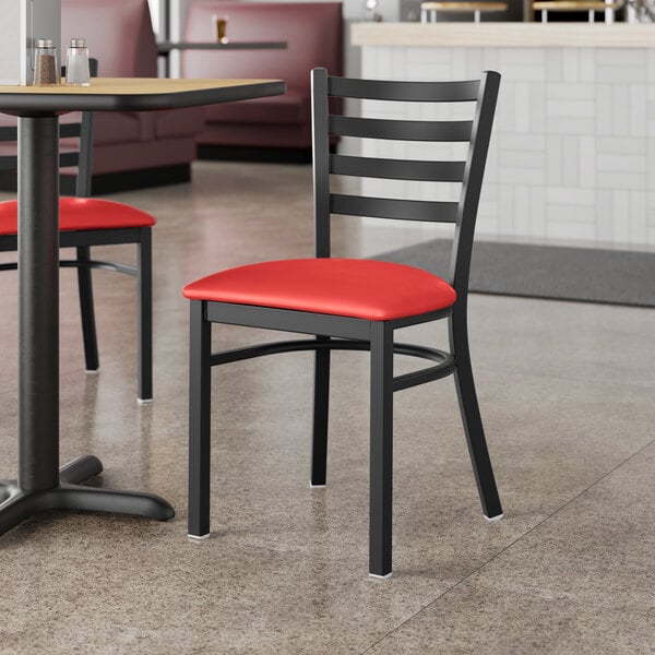 Lancaster Table & Seating Black Finish Ladder Back Chair with 2 1/2" Red Vinyl Padded Seat - Detached