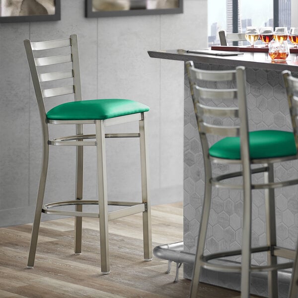 Lancaster Table & Seating Clear Coat Finish Ladder Back Bar Stool with 2 1/2" Green Vinyl Padded Seat - Assembled