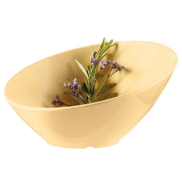 A GET Diamond Harvest squash melamine bowl with lavender flowers in it.
