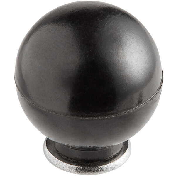 A black round object with a silver metal base.