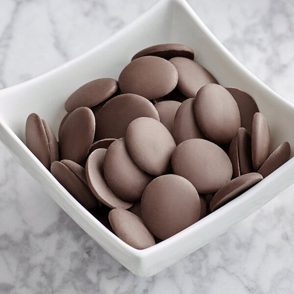 A bowl of Guittard Musique Foncee chocolate wafers.