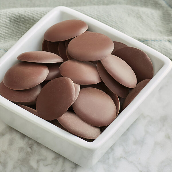 A bowl of Guittard Lever du Soleil semi-sweet wafers.