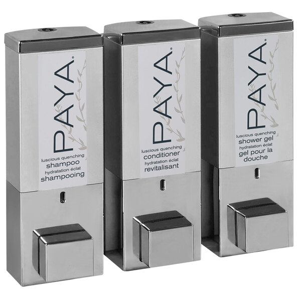 A chrome wall-mounted Dispenser Amenities shower dispenser with three satin silver Paya bottles.