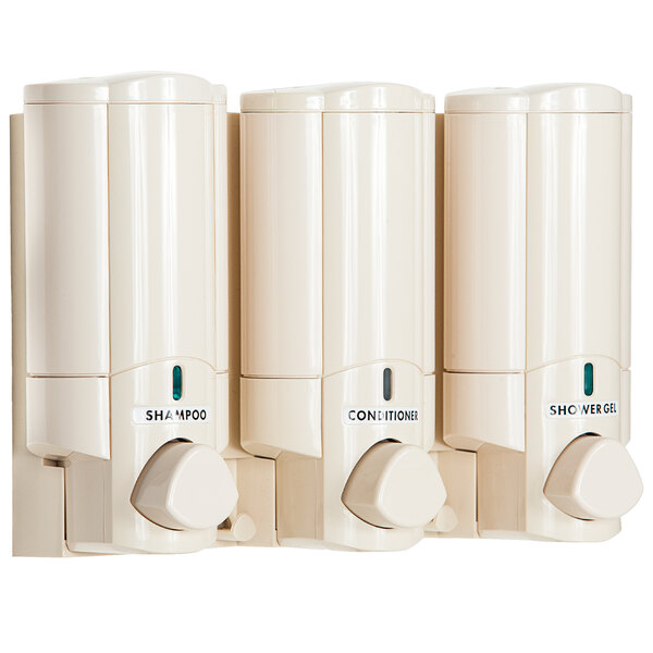 Three white Dispenser Amenities Aviva soap dispensers on a white wall.