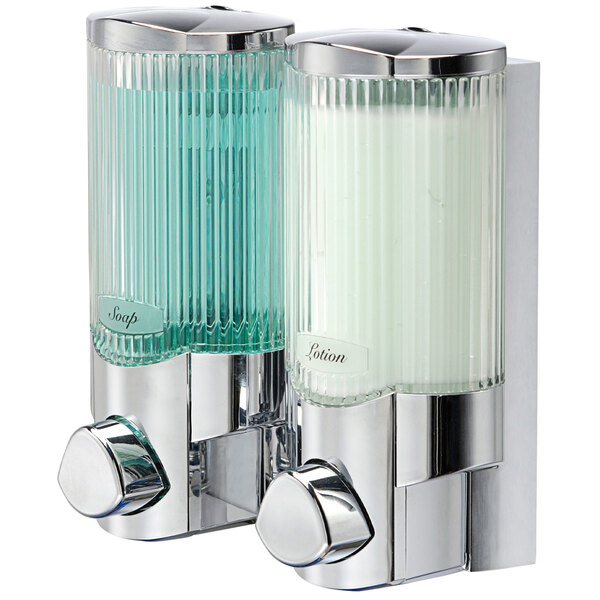 A chrome wall-mounted soap dispenser with two translucent bottles.