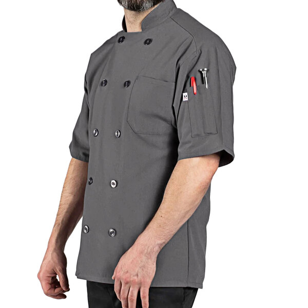 A man wearing a slate grey Uncommon Chef short sleeve chef coat.