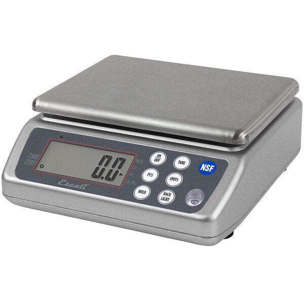 A San Jamar water resistant digital portion scale with a grey finish on a counter.