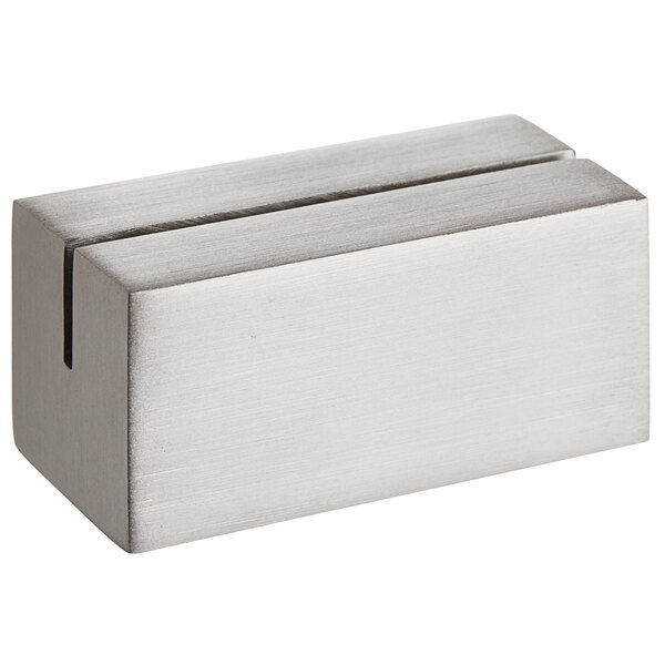 A silver rectangular brushed stainless steel Front of the House card holder with a hole in the middle.