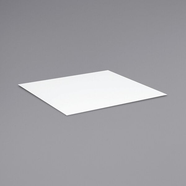 A white square on a gray surface.