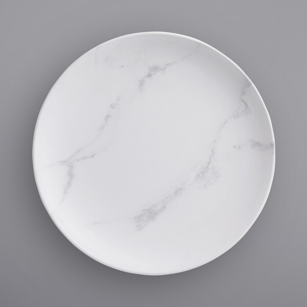 A white American Metalcraft melamine plate with a marble pattern.