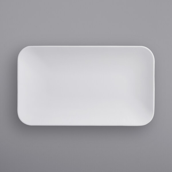 A white rectangular American Metalcraft melamine platter on a gray surface.