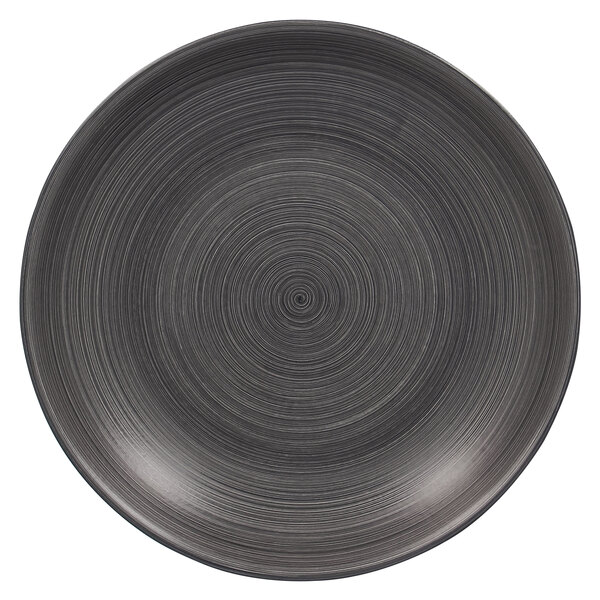 A black RAK Porcelain Trinidad deep coupe porcelain plate with a spiral pattern on it.