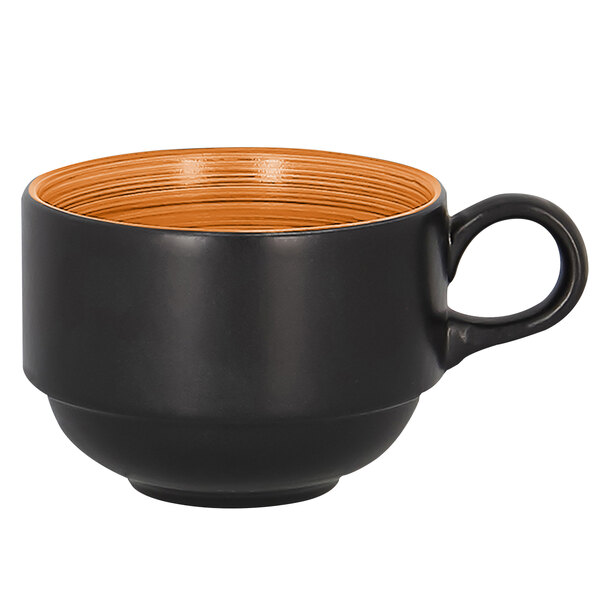 A stackable black and orange RAK Porcelain Trinidad cup with a handle.
