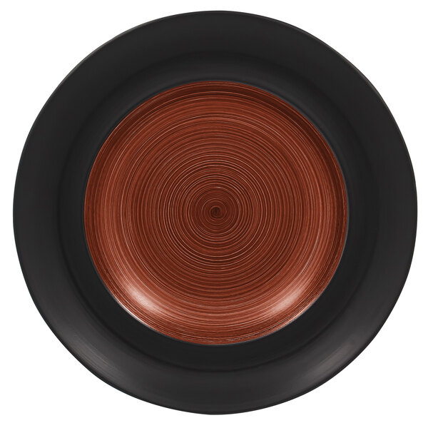 A close up of a RAK Porcelain walnut and black porcelain plate with a spiral design on the rim.
