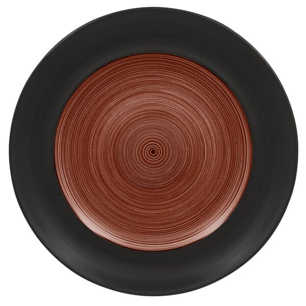 A white porcelain plate with a walnut and black circular design on the rim.