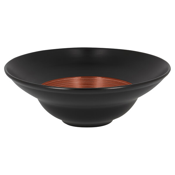 A RAK Porcelain walnut and black porcelain plate with a red stripe on the rim.