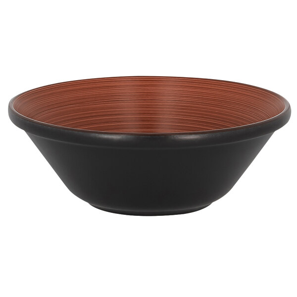 A black bowl with brown stripes on the rim.