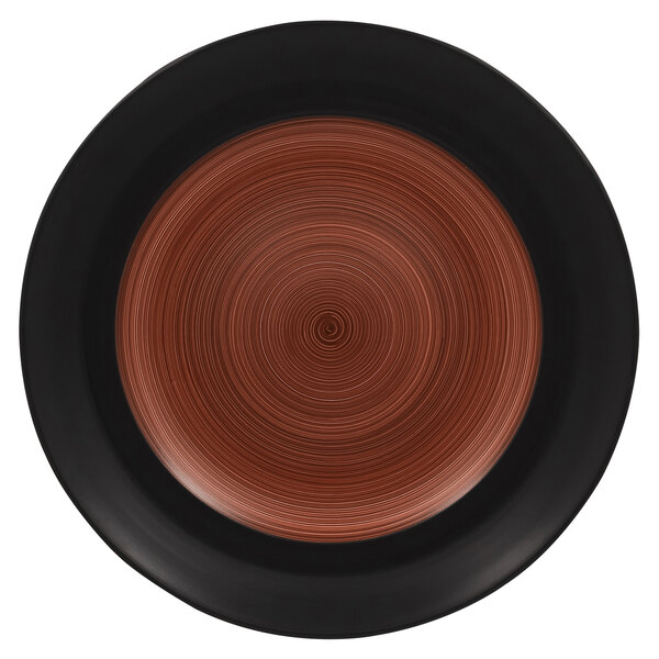 A brown porcelain plate with a black swirl design on the rim.