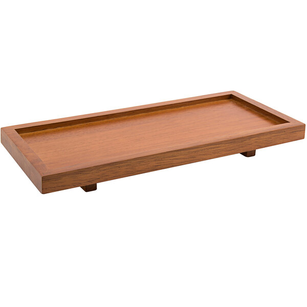 A Room360 rubberwood rectangular footed serving tray on a wooden table.