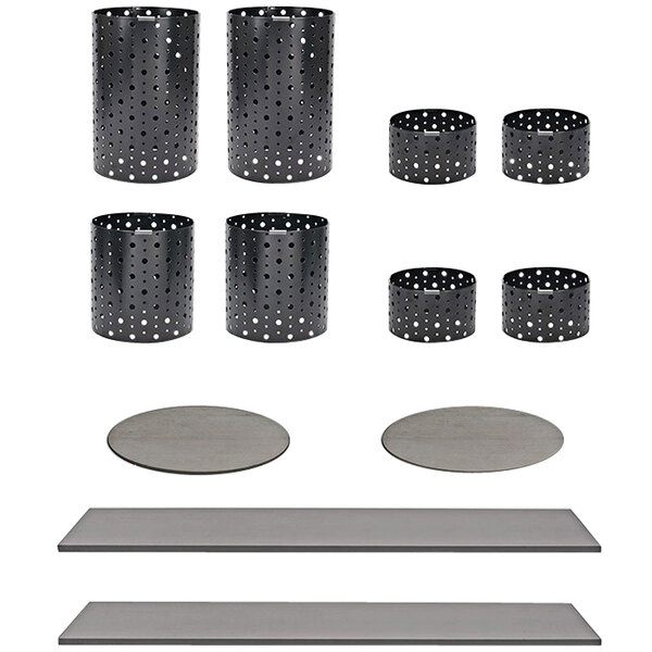 A Front of the House black stainless steel riser set with white dots on the containers.