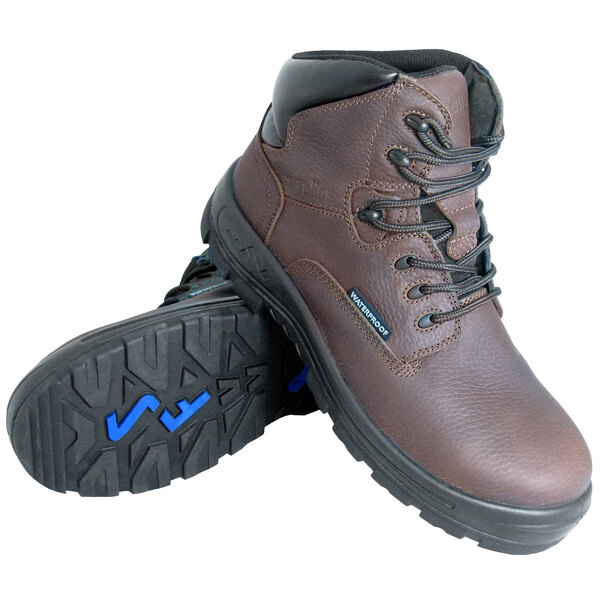 A pair of Genuine Grip brown work boots with a composite toe and blue laces.