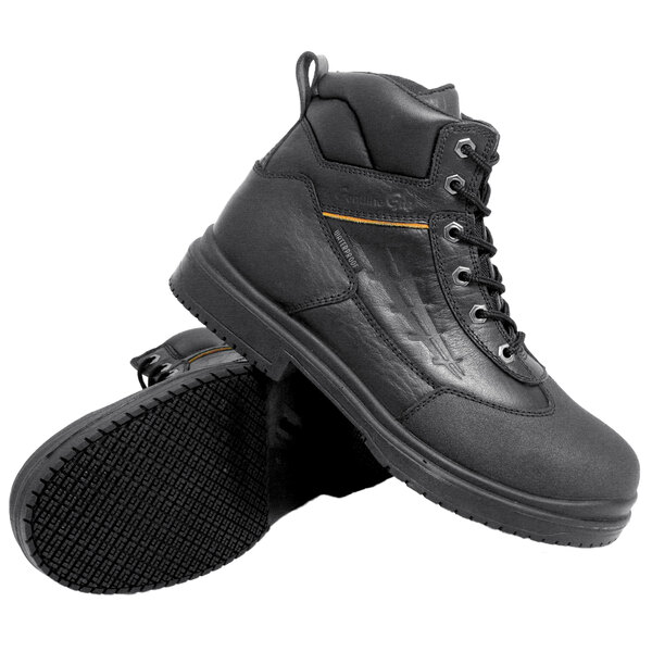 A pair of black Genuine Grip steel toe work boots with a yellow sole.