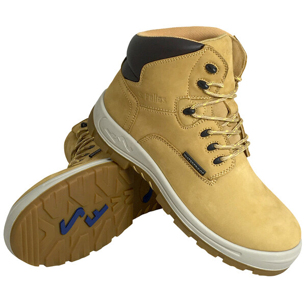 A close-up of a pair of wheat colored Genuine Grip men's safety boots with laces.