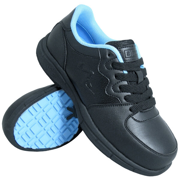 A pair of black Genuine Grip athletic shoes.