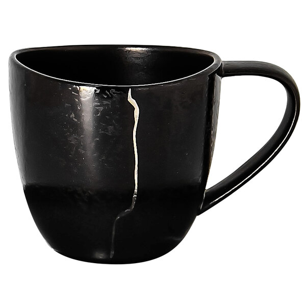 A black RAK Porcelain espresso cup with a silver crack.