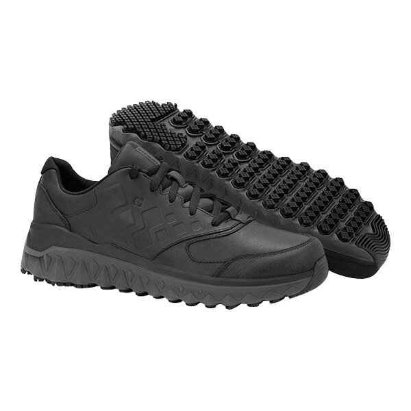 A pair of black Shoes For Crews women's athletic shoes.