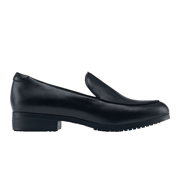 A black shoe with a pointed toe and rubber sole.