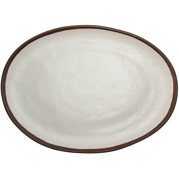 A white oval melamine platter with a brown rim.