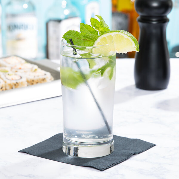 A Libbey Collins glass of water with lime and mint leaves.