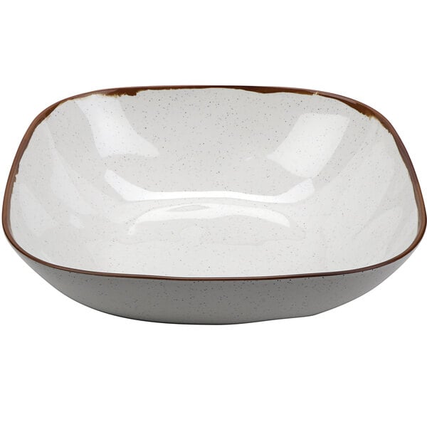A white square melamine bowl with a brown rim.