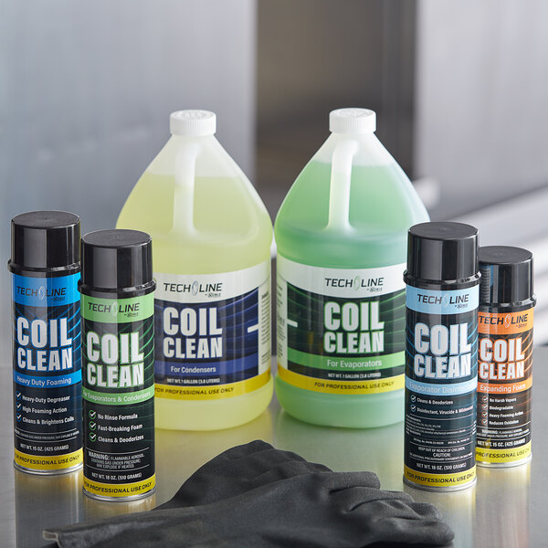 A blue and white can of Noble Chemical Tech Line No Rinse Evaporator Coil Cleaner next to a bottle of liquid.