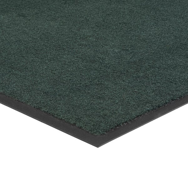 A green Lavex Olefin entrance mat with black trim.