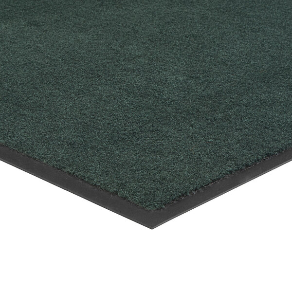 A green Lavex Olefin entrance mat with black trim on top.